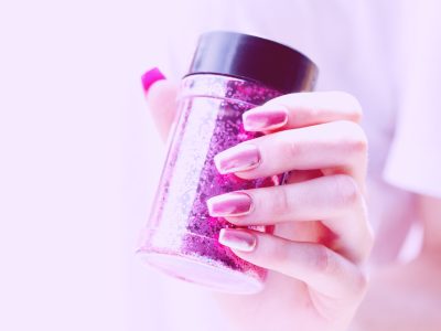 person holding pink container